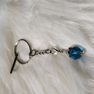 Handcrafted key chain with light blue stone